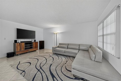 First-floor, fully renovated lakefront residence designed for on Wynmoor Golf Course in Florida - for sale on GolfHomes.com, golf home, golf lot