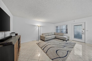 FIRST FLOOR -- COMPLETELY RENOVATED LAKEFRONT HOME that will on Wynmoor Golf Course in Florida - for sale on GolfHomes.com, golf home, golf lot