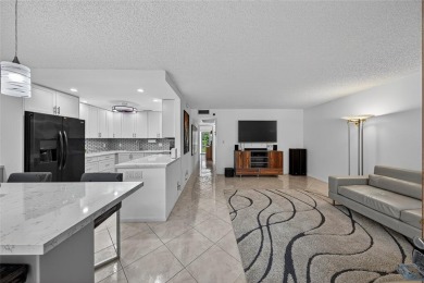 FIRST FLOOR -- COMPLETELY RENOVATED LAKEFRONT HOME that will on Wynmoor Golf Course in Florida - for sale on GolfHomes.com, golf home, golf lot