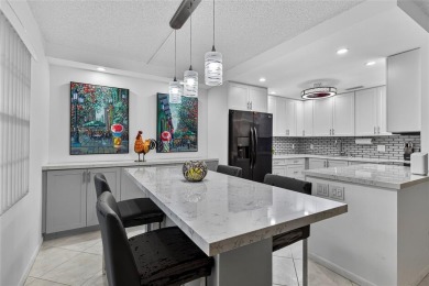 FIRST FLOOR -- COMPLETELY RENOVATED LAKEFRONT HOME that will on Wynmoor Golf Course in Florida - for sale on GolfHomes.com, golf home, golf lot