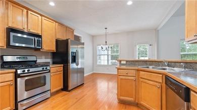 Discover this beautifully maintained 5-bedroom, 3.5 bath home on Summergrove Golf Club in Georgia - for sale on GolfHomes.com, golf home, golf lot