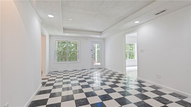 Discover this beautifully maintained 5-bedroom, 3.5 bath home on Summergrove Golf Club in Georgia - for sale on GolfHomes.com, golf home, golf lot