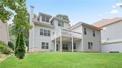 Discover this beautifully maintained 5-bedroom, 3.5 bath home on Summergrove Golf Club in Georgia - for sale on GolfHomes.com, golf home, golf lot