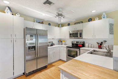 This charming home is perfectly situated on an oversized golf on Riverbend Golf Club in Florida - for sale on GolfHomes.com, golf home, golf lot