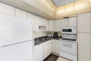 Step into this lower penthouse condo where vintage charm meets on Palm-Aire Country Club and Resort - Palms in Florida - for sale on GolfHomes.com, golf home, golf lot