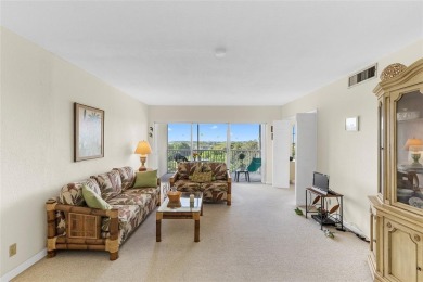 Step into this lower penthouse condo where vintage charm meets on Palm-Aire Country Club and Resort - Palms in Florida - for sale on GolfHomes.com, golf home, golf lot