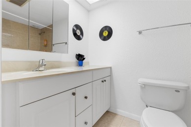 Step into this lower penthouse condo where vintage charm meets on Palm-Aire Country Club and Resort - Palms in Florida - for sale on GolfHomes.com, golf home, golf lot