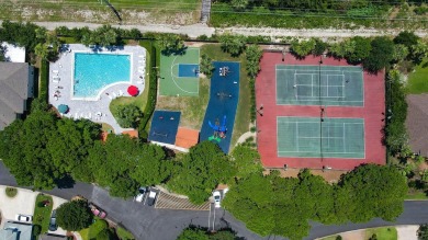 Welcome to this charming lakefront home in the private gated on Emerald Bay Golf Club in Florida - for sale on GolfHomes.com, golf home, golf lot