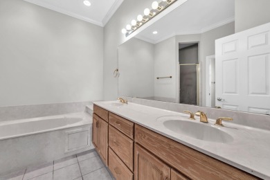 Welcome to this charming lakefront home in the private gated on Emerald Bay Golf Club in Florida - for sale on GolfHomes.com, golf home, golf lot