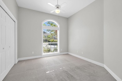 Welcome to this charming lakefront home in the private gated on Emerald Bay Golf Club in Florida - for sale on GolfHomes.com, golf home, golf lot