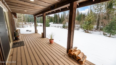 This beautiful single-level home sits on the Priest Lake Golf on Priest Lake Golf and Tennis Club in Idaho - for sale on GolfHomes.com, golf home, golf lot