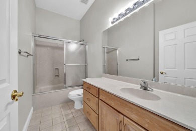 Welcome to this charming lakefront home in the private gated on Emerald Bay Golf Club in Florida - for sale on GolfHomes.com, golf home, golf lot