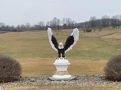 A beautiful building site overlooking the 7th hole and pond of on Eagle Glen Golf Course in Michigan - for sale on GolfHomes.com, golf home, golf lot