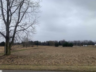 A beautiful building site overlooking the 7th hole and pond of on Eagle Glen Golf Course in Michigan - for sale on GolfHomes.com, golf home, golf lot