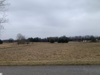 A beautiful building site overlooking the 7th hole and pond of on Eagle Glen Golf Course in Michigan - for sale on GolfHomes.com, golf home, golf lot