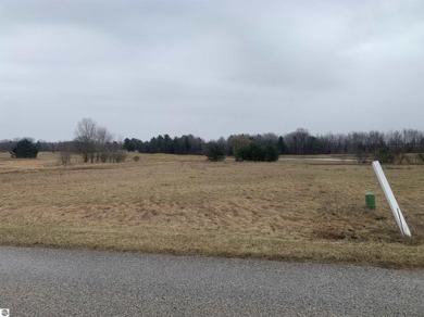 A beautiful building site overlooking the 7th hole and pond of on Eagle Glen Golf Course in Michigan - for sale on GolfHomes.com, golf home, golf lot