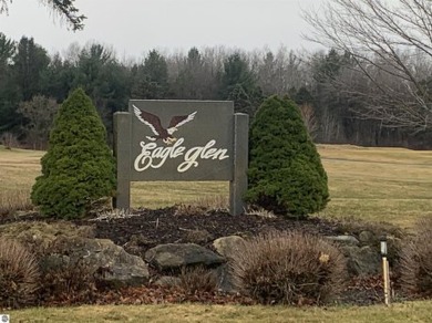 A beautiful building site overlooking the 7th hole and pond of on Eagle Glen Golf Course in Michigan - for sale on GolfHomes.com, golf home, golf lot