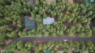 Escape to the pines in this 3 bed, 2.5 bath mountain retreat in on Pinetop Lakes Country Club in Arizona - for sale on GolfHomes.com, golf home, golf lot