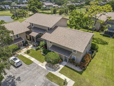 GORGEOUS IN RIVERBEND! Welcome to this terrific townhome with on Riverbend Golf Club in Florida - for sale on GolfHomes.com, golf home, golf lot