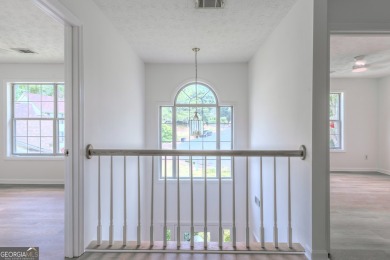 PRIME LOCATION! Beautiful traditional-style single-family home on TPC At Sugarloaf Golf Club in Georgia - for sale on GolfHomes.com, golf home, golf lot