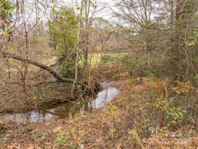 Explore this lovely residential building lot in downtown Black on Black Mountain Golf Course in North Carolina - for sale on GolfHomes.com, golf home, golf lot