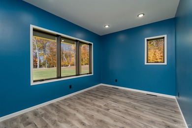 Experience refined modern living in this stunning 2025 on Indian Lake Golf and Country Club in Michigan - for sale on GolfHomes.com, golf home, golf lot