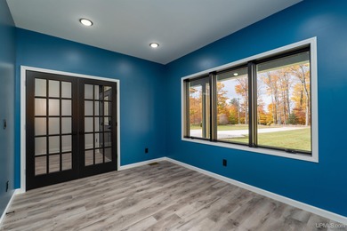 Experience refined modern living in this stunning 2025 on Indian Lake Golf and Country Club in Michigan - for sale on GolfHomes.com, golf home, golf lot