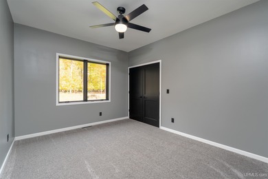 Experience refined modern living in this stunning 2025 on Indian Lake Golf and Country Club in Michigan - for sale on GolfHomes.com, golf home, golf lot