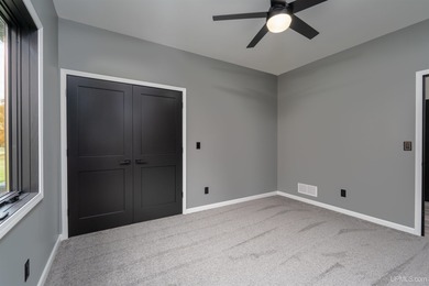 Experience refined modern living in this stunning 2025 on Indian Lake Golf and Country Club in Michigan - for sale on GolfHomes.com, golf home, golf lot