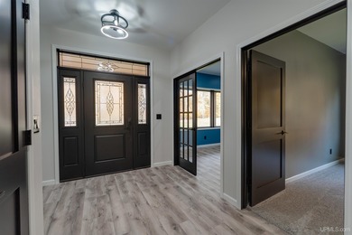 Experience refined modern living in this stunning 2025 on Indian Lake Golf and Country Club in Michigan - for sale on GolfHomes.com, golf home, golf lot
