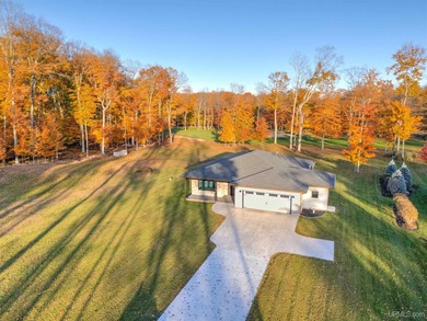Experience refined modern living in this stunning 2025 on Indian Lake Golf and Country Club in Michigan - for sale on GolfHomes.com, golf home, golf lot