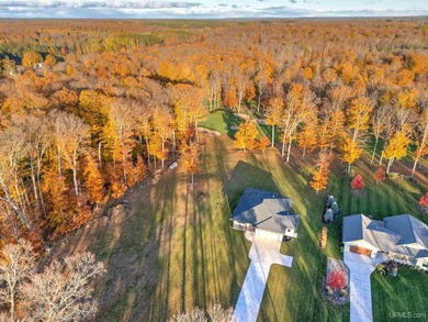 Experience refined modern living in this stunning 2025 on Indian Lake Golf and Country Club in Michigan - for sale on GolfHomes.com, golf home, golf lot