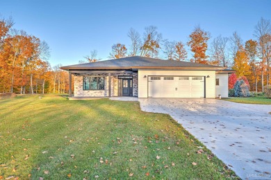 Experience refined modern living in this stunning 2025 on Indian Lake Golf and Country Club in Michigan - for sale on GolfHomes.com, golf home, golf lot