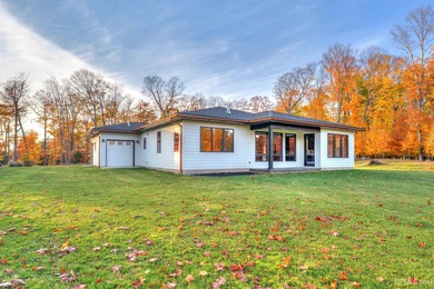 Experience refined modern living in this stunning 2025 on Indian Lake Golf and Country Club in Michigan - for sale on GolfHomes.com, golf home, golf lot