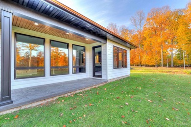 Experience refined modern living in this stunning 2025 on Indian Lake Golf and Country Club in Michigan - for sale on GolfHomes.com, golf home, golf lot