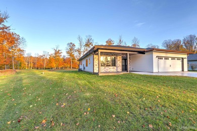 Experience refined modern living in this stunning 2025 on Indian Lake Golf and Country Club in Michigan - for sale on GolfHomes.com, golf home, golf lot