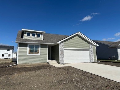 Step into Modern Elegance at Spring Meadows! This beautiful on Sugar Creek Golf Course in Iowa - for sale on GolfHomes.com, golf home, golf lot
