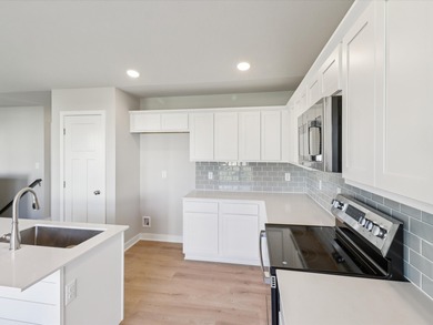 Step into Modern Elegance at Spring Meadows! This beautiful on Sugar Creek Golf Course in Iowa - for sale on GolfHomes.com, golf home, golf lot