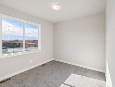 Step into Modern Elegance at Spring Meadows! This beautiful on Sugar Creek Golf Course in Iowa - for sale on GolfHomes.com, golf home, golf lot