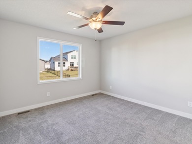 Step into Modern Elegance at Spring Meadows! This beautiful on Sugar Creek Golf Course in Iowa - for sale on GolfHomes.com, golf home, golf lot