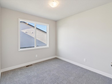 Step into Modern Elegance at Spring Meadows! This beautiful on Sugar Creek Golf Course in Iowa - for sale on GolfHomes.com, golf home, golf lot