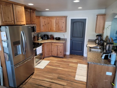Live where comfort meets golf course views! This 4-bedroom on Toana Vista Golf Course in Nevada - for sale on GolfHomes.com, golf home, golf lot
