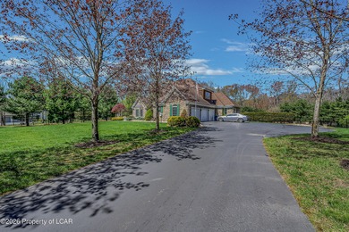 Private tree-lined driveway leads to this stunning 5 bedroom 6 on Blue Ridge Trail Golf Club in Pennsylvania - for sale on GolfHomes.com, golf home, golf lot