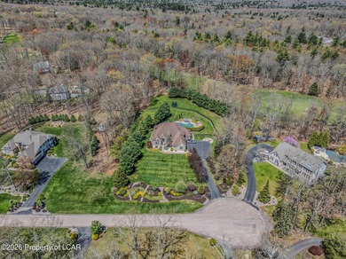 Private tree-lined driveway leads to this stunning 5 bedroom 6 on Blue Ridge Trail Golf Club in Pennsylvania - for sale on GolfHomes.com, golf home, golf lot