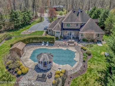 Private tree-lined driveway leads to this stunning 5 bedroom 6 on Blue Ridge Trail Golf Club in Pennsylvania - for sale on GolfHomes.com, golf home, golf lot