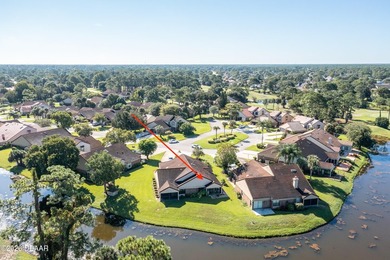Enjoy stunning water views of the golf course from the back on The Club At Pelican Bay - North Course in Florida - for sale on GolfHomes.com, golf home, golf lot