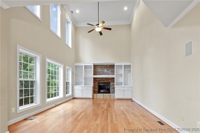 Nestled in a peaceful setting in Gates Four, this beautiful home on Gates Four Golf and Country Club in North Carolina - for sale on GolfHomes.com, golf home, golf lot