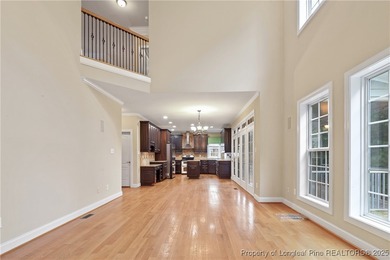 Nestled in a peaceful setting in Gates Four, this beautiful home on Gates Four Golf and Country Club in North Carolina - for sale on GolfHomes.com, golf home, golf lot