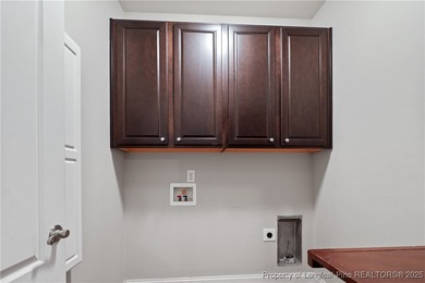 Nestled in a peaceful setting in Gates Four, this beautiful home on Gates Four Golf and Country Club in North Carolina - for sale on GolfHomes.com, golf home, golf lot