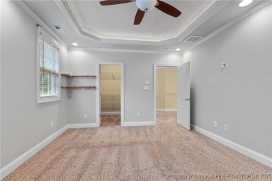 Nestled in a peaceful setting in Gates Four, this beautiful home on Gates Four Golf and Country Club in North Carolina - for sale on GolfHomes.com, golf home, golf lot